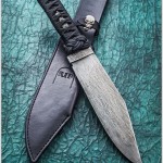 Ninja Bowie 14 inch over all 8 inch blade 1/4 inch thick Antiqued O1 Tool steel Black Epoxied nylon cord over Black Stingray. RIP804